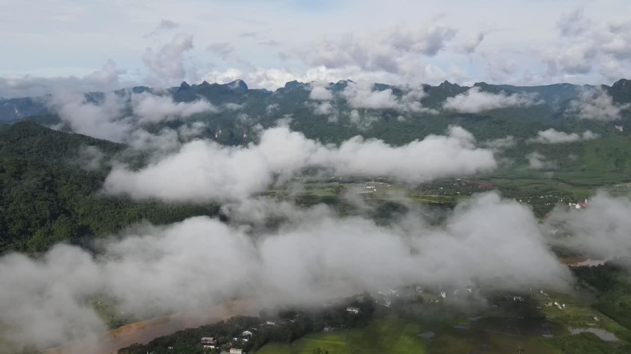 Drone shot above the cloud of beautiful mountainous village in Phong Nha early morning