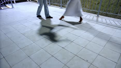 couple dancing on a patio at night