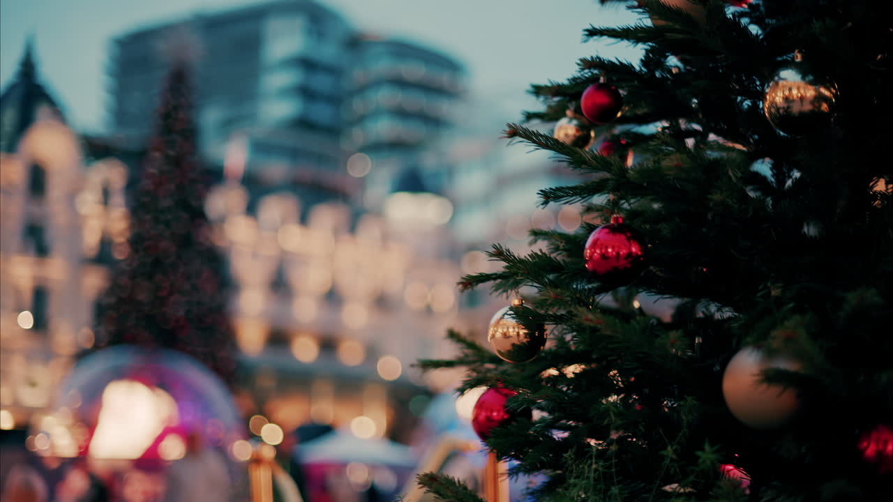 Close up of decorations on a Christmas tree in front of the Monte Carlo Casino in Monaco in the evening