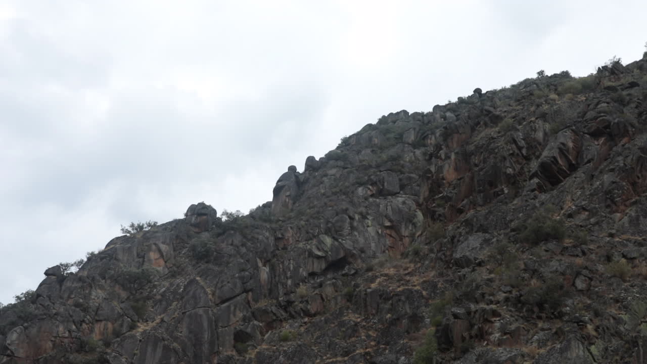 Rugged Rocky Mountainside Under an Overcast Sky