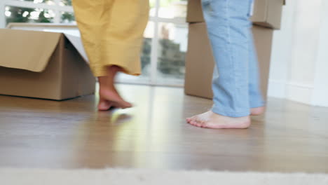 feet, dance or couple in celebration in new home