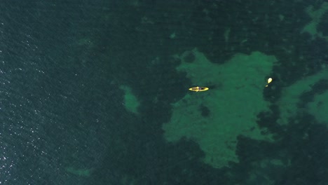 aerial view of kayak fishing at seascape, trolling fishing drone view