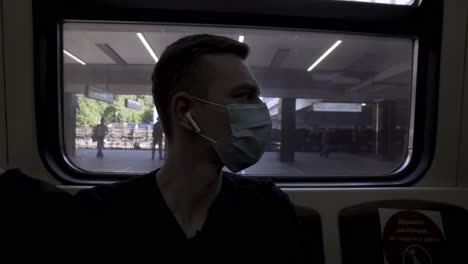 man wearing mask on subway