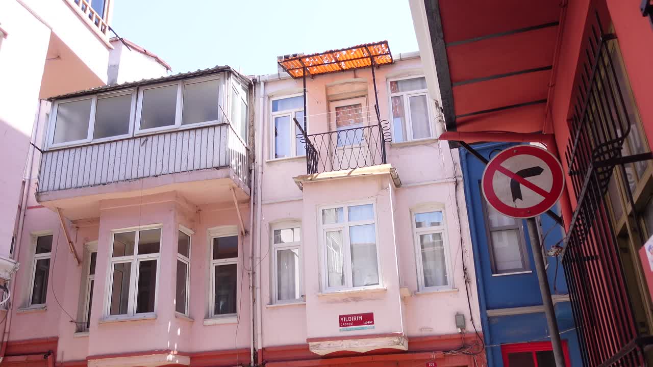 Colorful Old Town Houses with Balconies and Street Sign