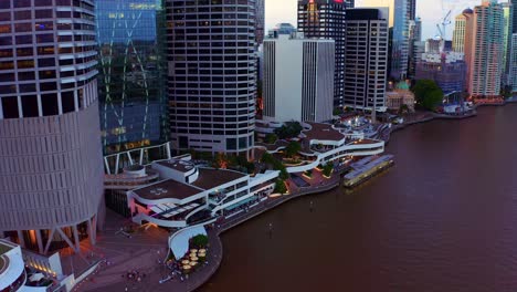 Eagle-Street-Pier-Ferry-Terminal-Along-Brisbane-River-With-Calm-Waters-At-Sunset-In-Queensland,-Australia