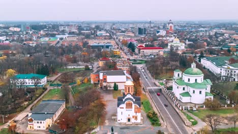 4k aerial view timelapse of roundabout road with circular cars in small european city