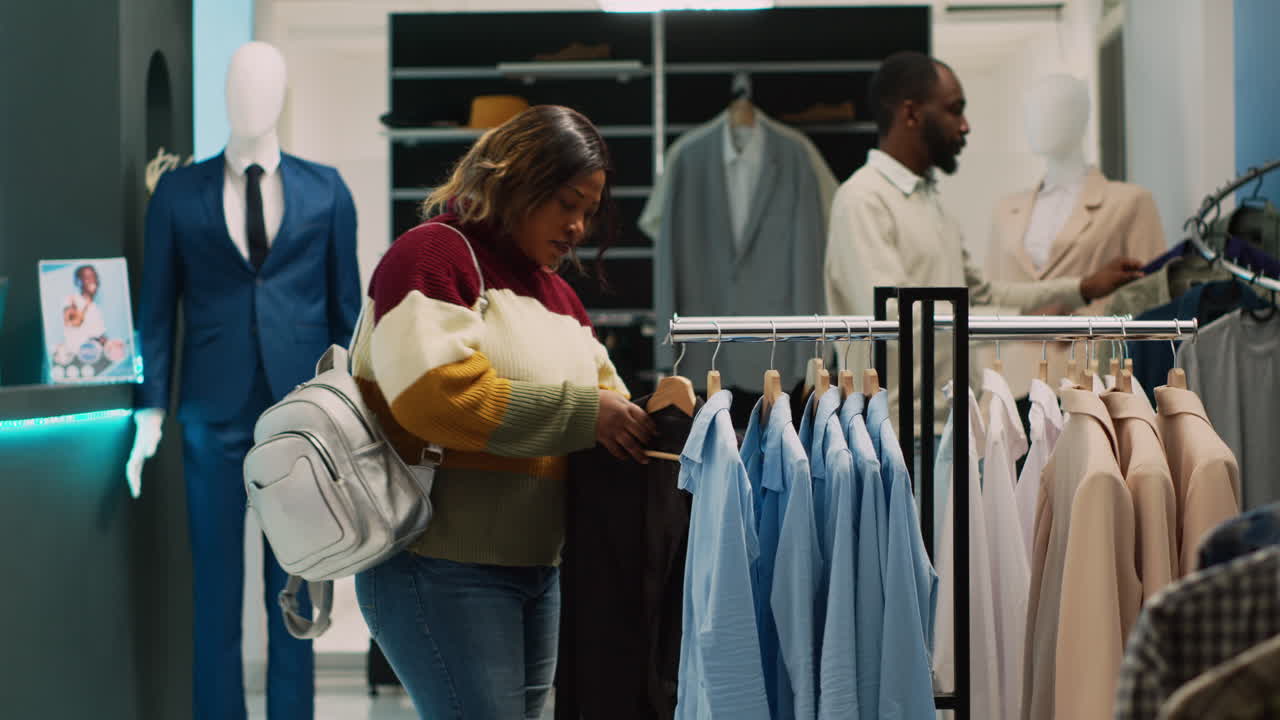 People shopping for clothing in a retail store