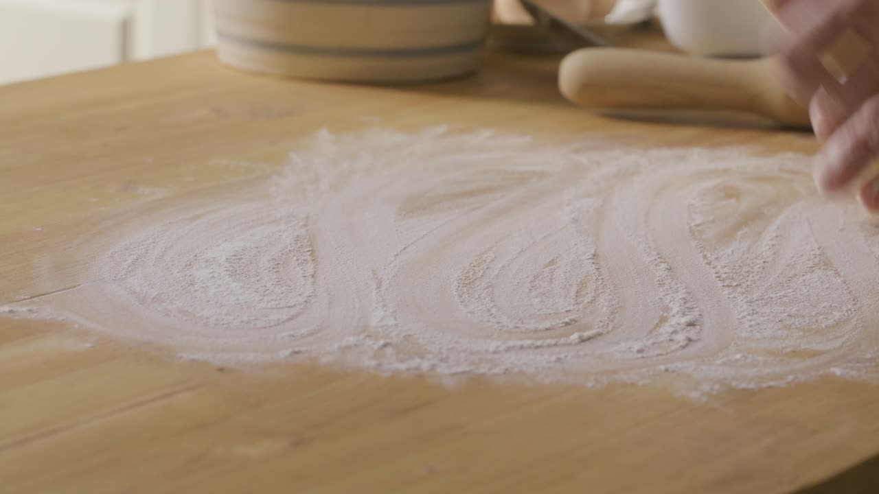 Hands of Cook Dusting Table with Flour and Preparing Dough for Rolling Out