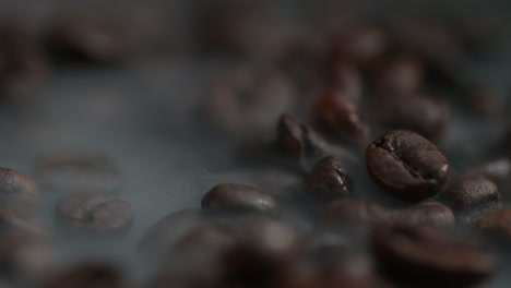 macro of a smoke rises above the coffee bean