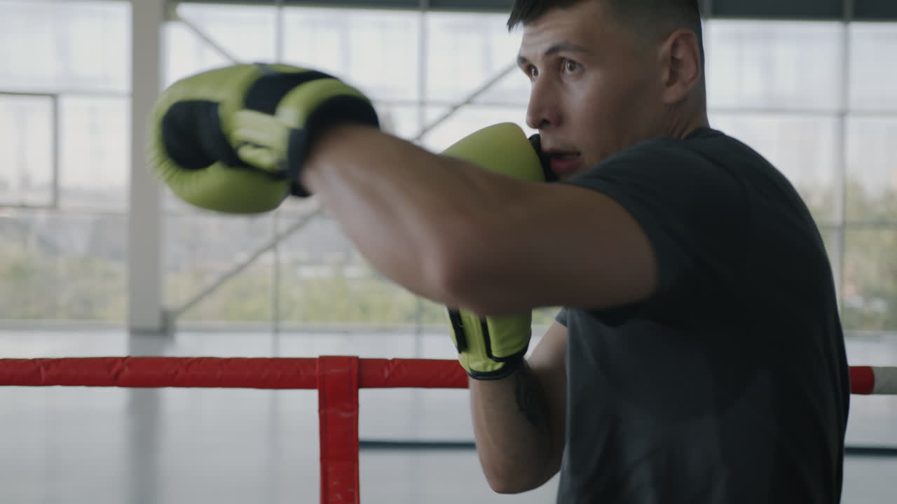 Man Boxing Training in a Gym Ring