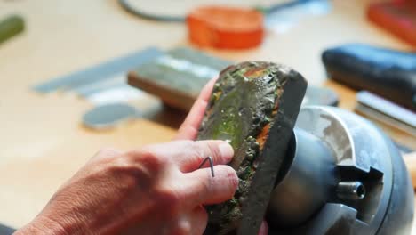 Hands-of-craftswoman-working-in-workshop