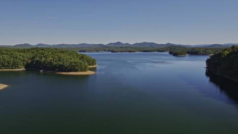 blue ridge lake georgia aerial v1 cinematic drone flyover water reservoir capturing crystal clear water lake surrounded by mountain landscape - shot with mavic 3 cine - october 2022