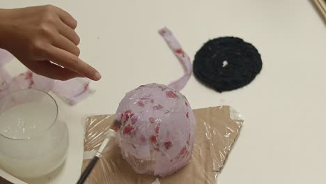 layering recycled strips of fabric and cornstarch glue on a mold to create a pencil holder, diy craft project