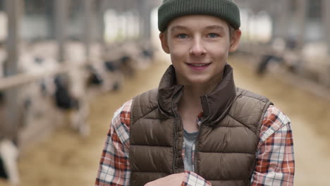 teenage boy posing at dairy farm