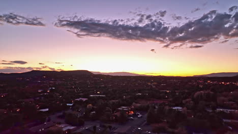 cinematic twilight drone shot of sedona arizona with the sun setting