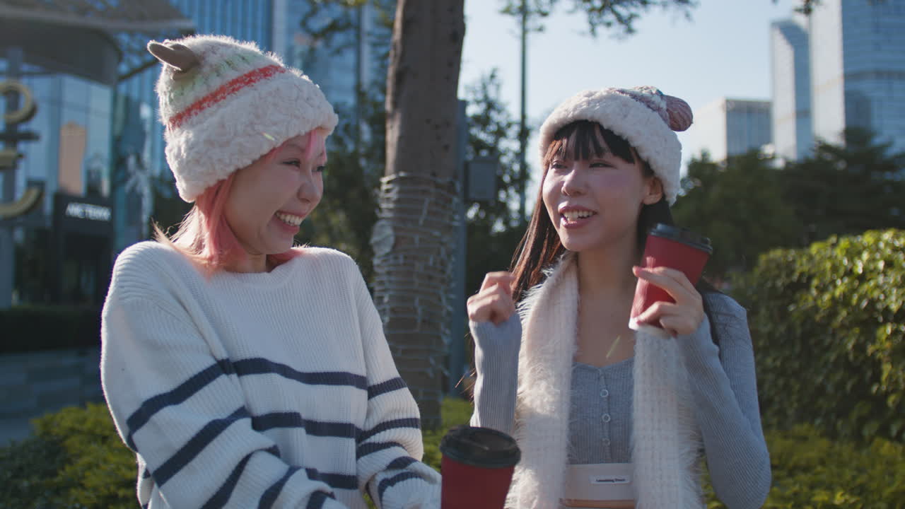 Two friends enjoying coffee in the park