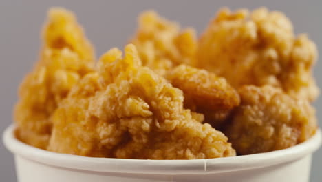 crispy fried chicken in a white cup