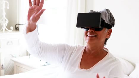 senior woman using virtual reality headset 4k