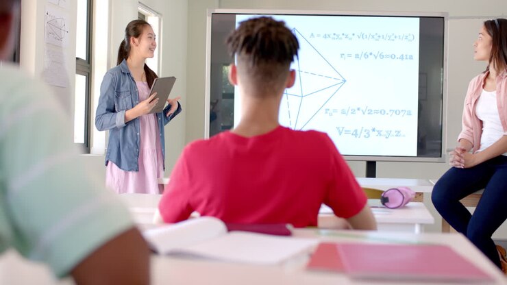 Young biracial woman teaches in a high school classroom
