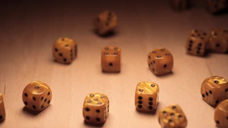 Many-golden-dice-rolling-in-slow-motion