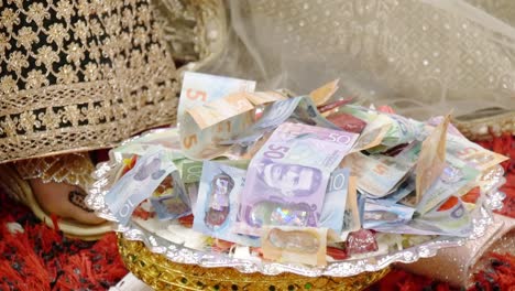 shot of new zealand cash used as dowry in a wedding