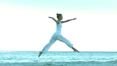 attractive woman dancing on the beach