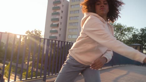 low angle view of black woman dancing on the bridge