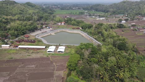aerial view, imogiri embung or imogiri reservoir in imogiri bantul which is a place to accommodate the flow of rainwater which has a shape like a puppet mountain