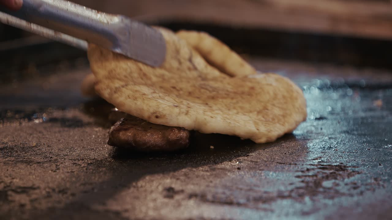 flatbread and grilled meat sizzle on a hot griddle at Varazdin Spancirfest festival