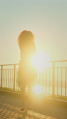woman enjoying a sunset walk