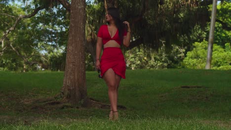 a woman donned in red enhanced the beauty of a tropical park in the caribbean