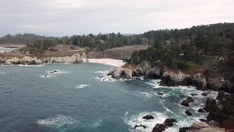 sweeping drone shot of northern california beach