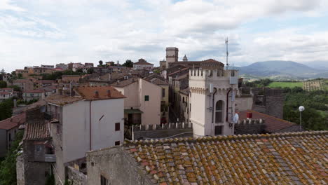 Houses-And-Rooftops-In-Stimigliano,-Italy---Drone-Pullback