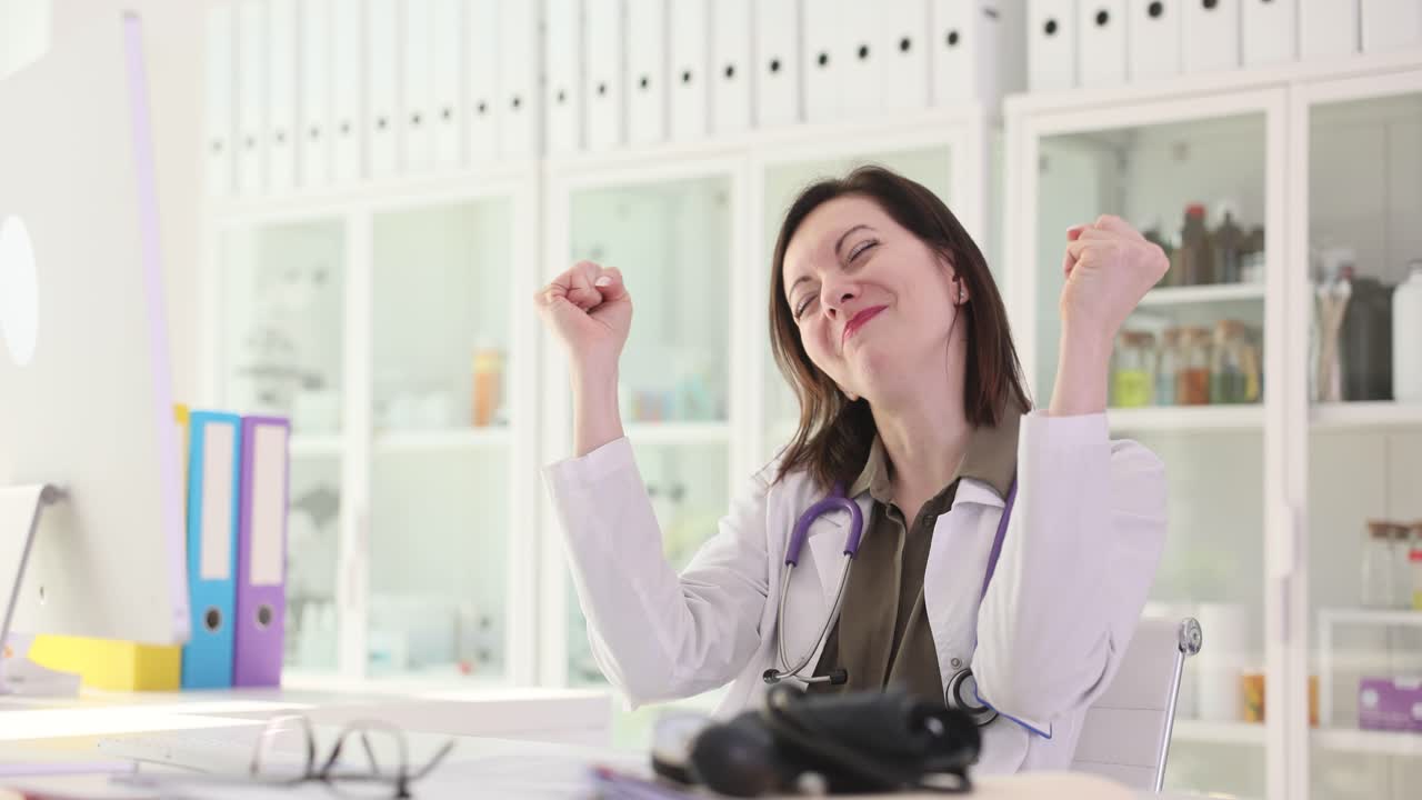 Excited Doctor Celebrating Success in Her Office
