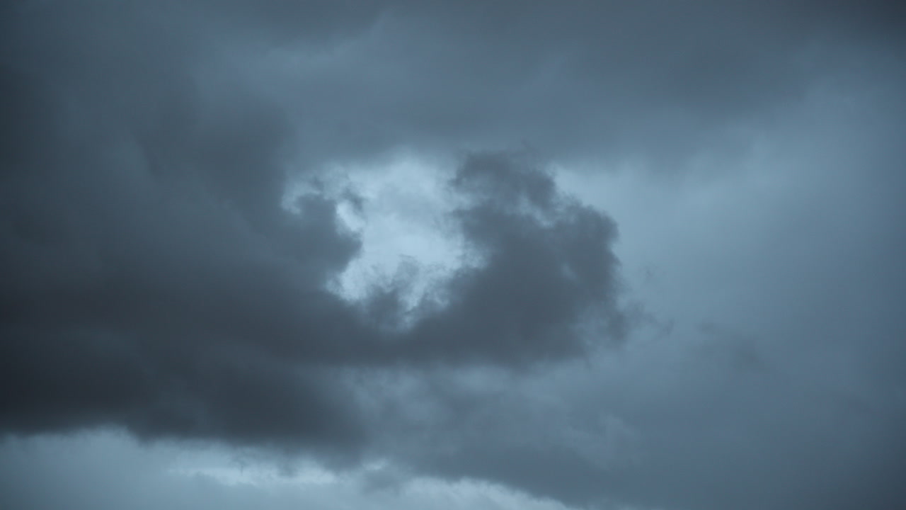 Moody clouds moving with the wind and gives an anxious vibe. It gives a sense of fear and fright over something