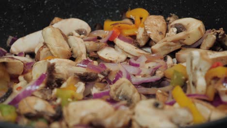 motion controlled shot of mushrooms in a cooking pan