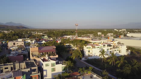 Aerial-of-sunset-on-beach-town-in-Mexico