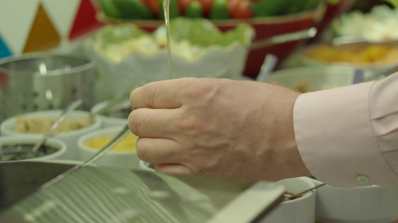 Buffet food with condiments and salad