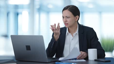 Stressed-Indian-female-manager-working-on-laptop