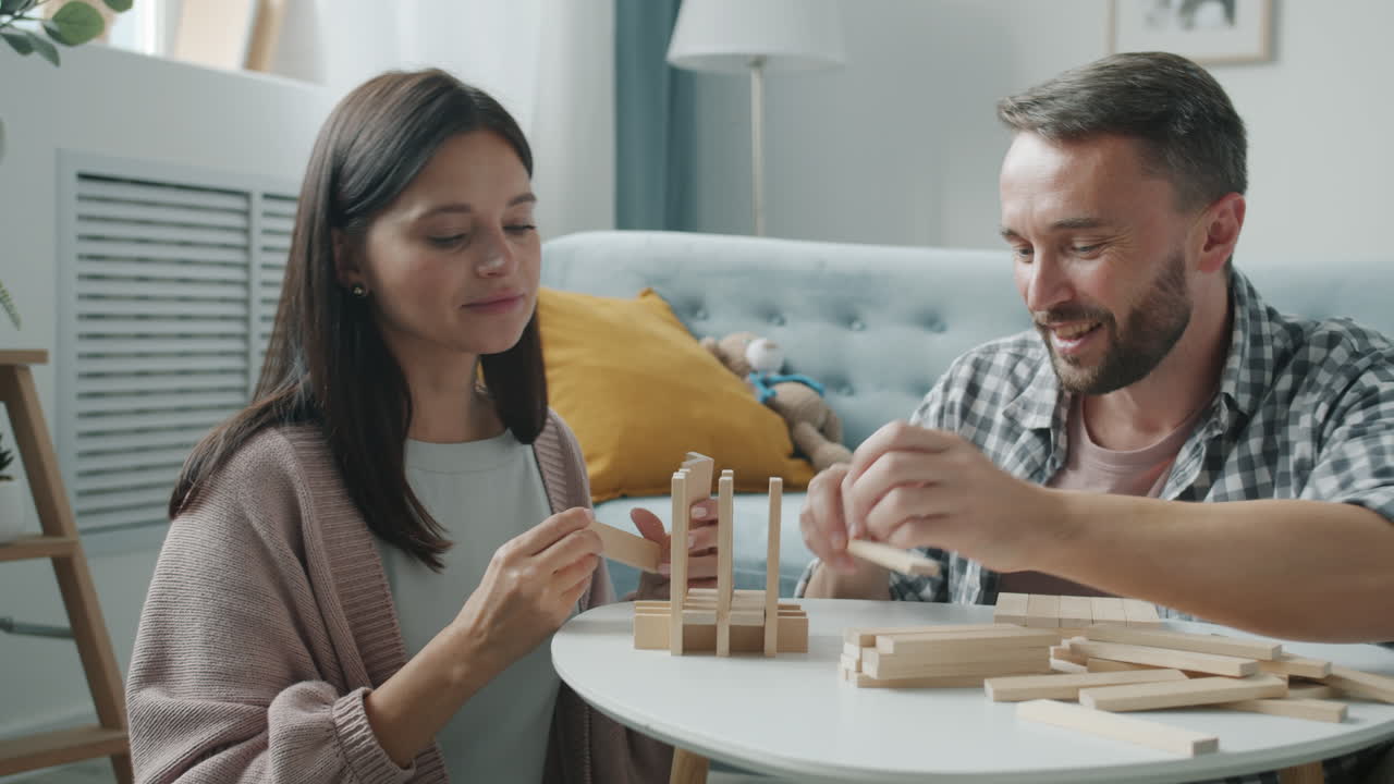 Couple Playing a Wooden Block Game