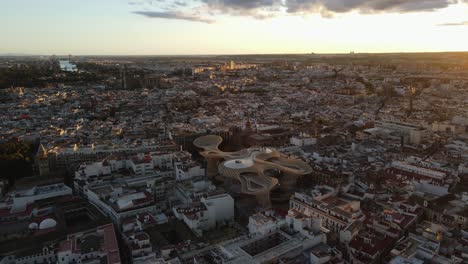 aerial drone shot of seville, the capital city of spain's andalusia region. seville is known for its culture, heritage, and being the birthplace of flamenco. also seen is "las setas"