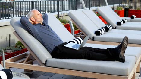 businessman relaxing on sun lounger in hotel 4k