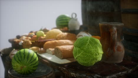 food table with wine barrels and some fruits, vegetables and bread