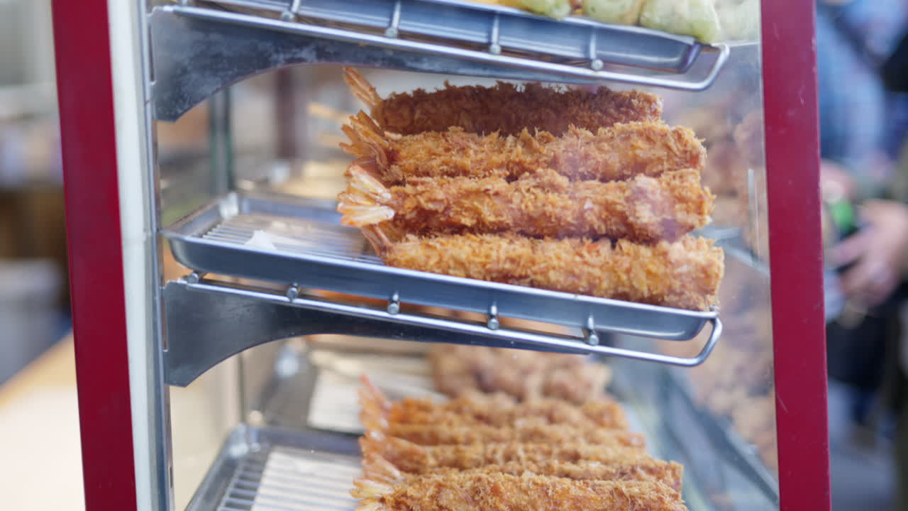 Different types of deep fried seafood on display at the Tsukiji Fish Market in Japan