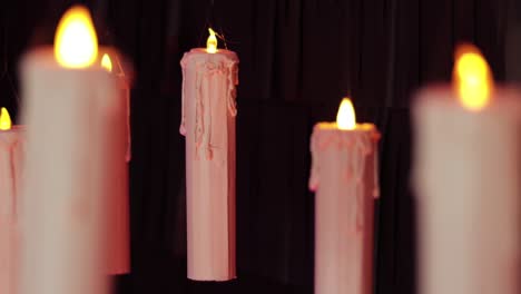 floating candles with black backdrop (steadycam). unfocused and focused.