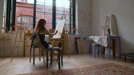 artist painting on a canvas