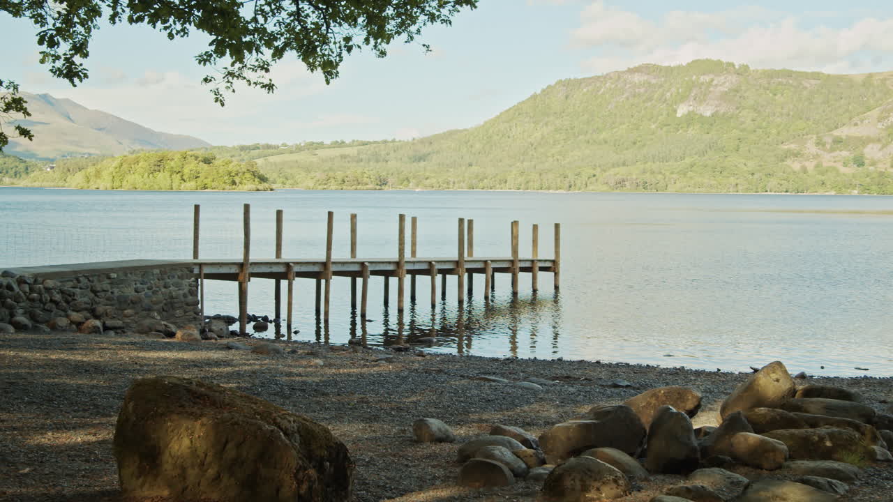 Jetty looking across Derwentwater Lake, panning shot, Lake District