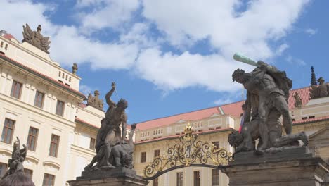 a group of statues are standing in front of a building