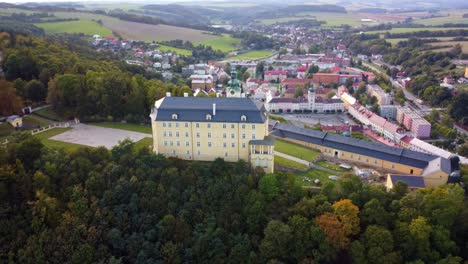 fulnek castle, located atop a hill in the czech republic - aerial pullback