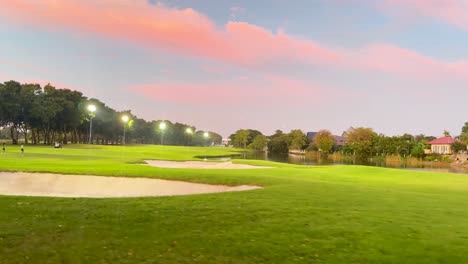 golf course at sunset with vibrant skies